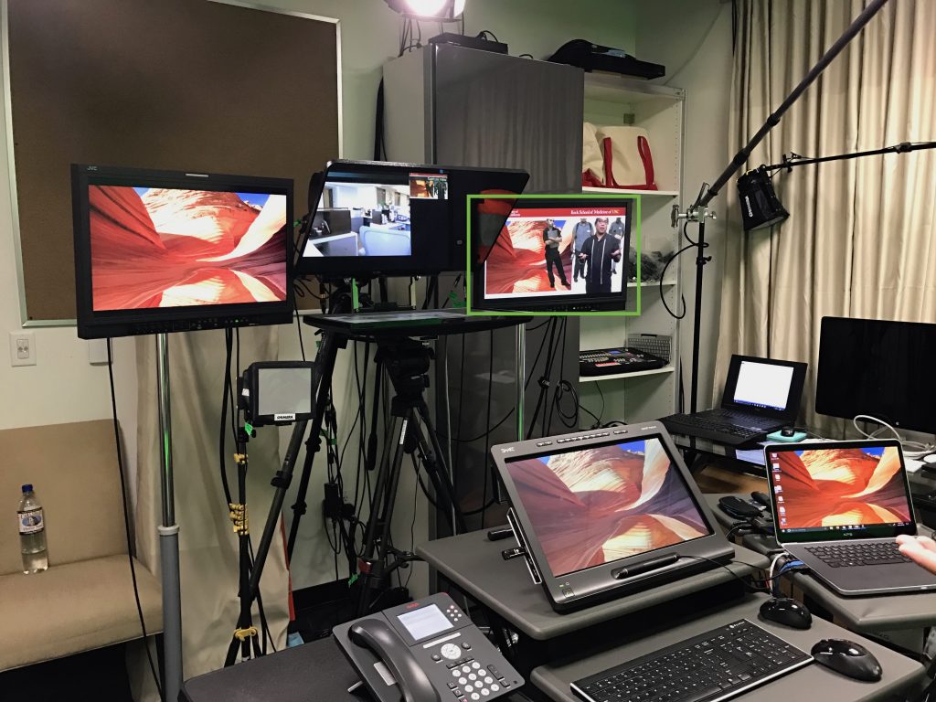 Picture 3: In the green box is an example of how multimedia can be projected on one side of the monitor, while the other side of the monitor is the instructor lecturing.